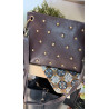 Bolso tachuelas piel